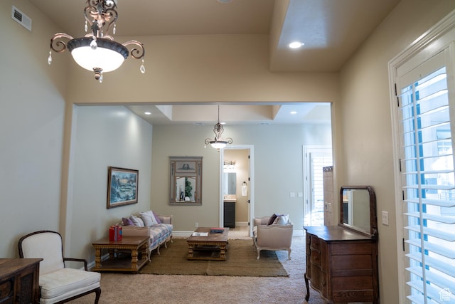 living room with recessed lighting, visible vents, baseboards, and carpet floors