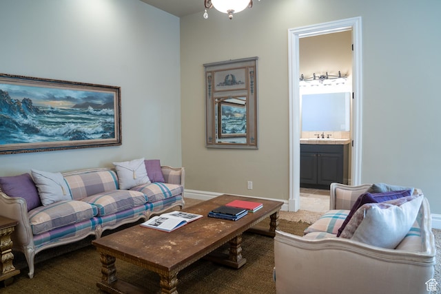 living room with light colored carpet and baseboards