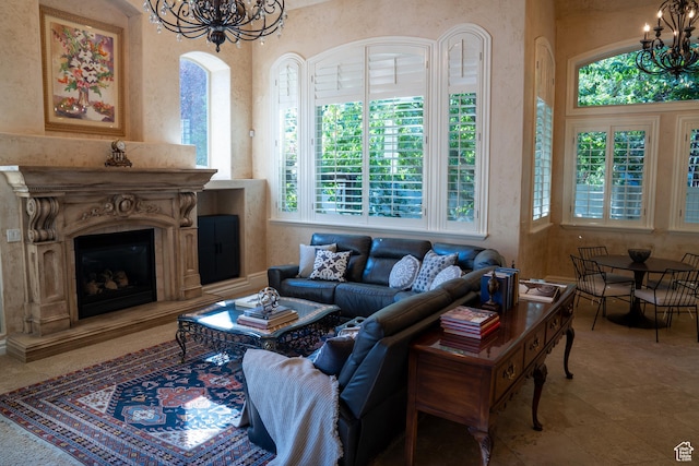 living area with an inviting chandelier and a premium fireplace