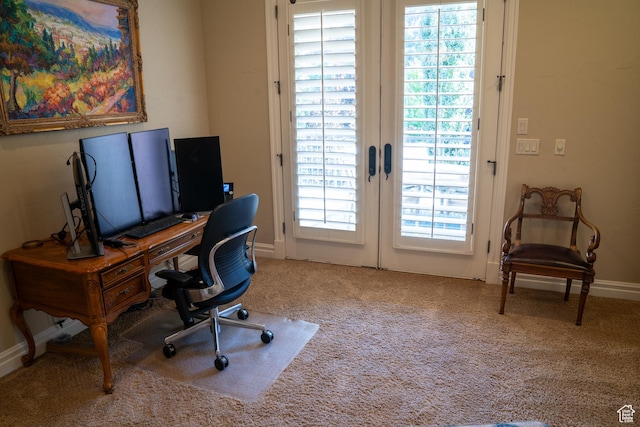 carpeted office space with french doors and baseboards