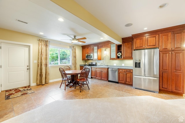 2662 N 1550 W, Pleasant Grove, UT 84062 - kitchen with appliances with stainless steel finishes, baseboards, brown cabinetry, recessed lighting, and backsplash