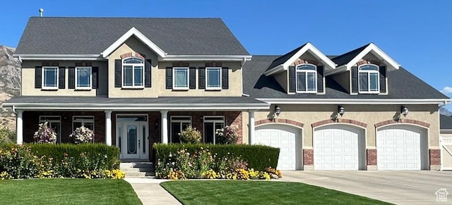 2662 N 1550 W, Pleasant Grove, UT 84062 - view of front of home with a front yard, a garage, and concrete driveway