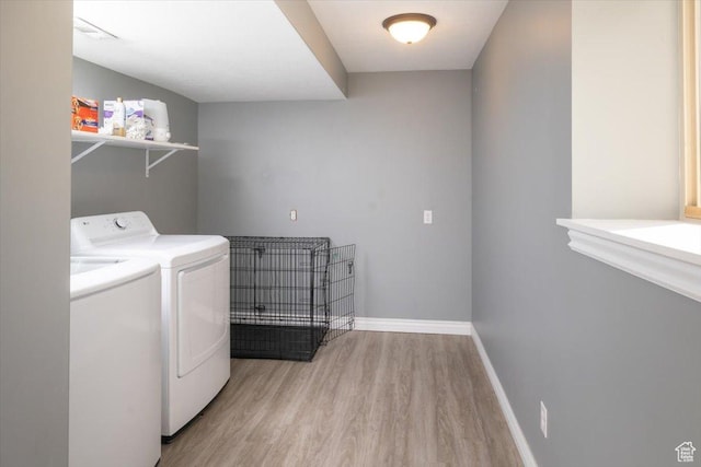 783 W 900 S, Tremonton, UT 84337 - washroom with visible vents, baseboards, washer and clothes dryer, laundry area, and light wood-style floors