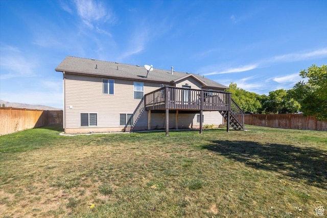 783 W 900 S, Tremonton, UT 84337 - back of property featuring stairway, a fenced backyard, a lawn, and a wooden deck
