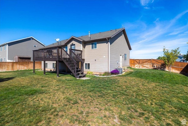783 W 900 S, Tremonton, UT 84337 - rear view of property featuring a yard, stairway, a wooden deck, and a fenced backyard