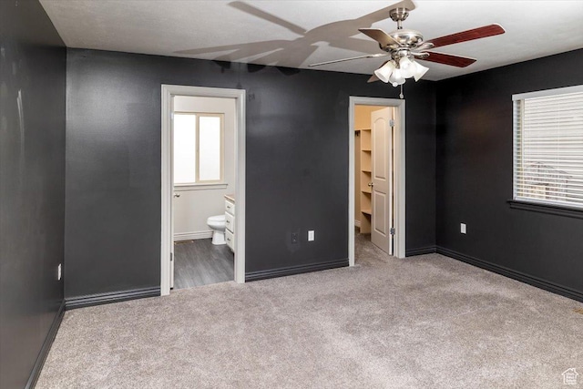 783 W 900 S, Tremonton, UT 84337 - unfurnished bedroom featuring ensuite bath, carpet flooring, baseboards, and ceiling fan