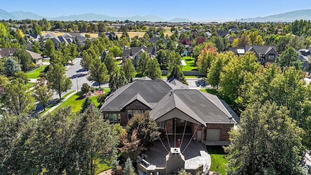 birds eye view of property with a mountain view and a residential view