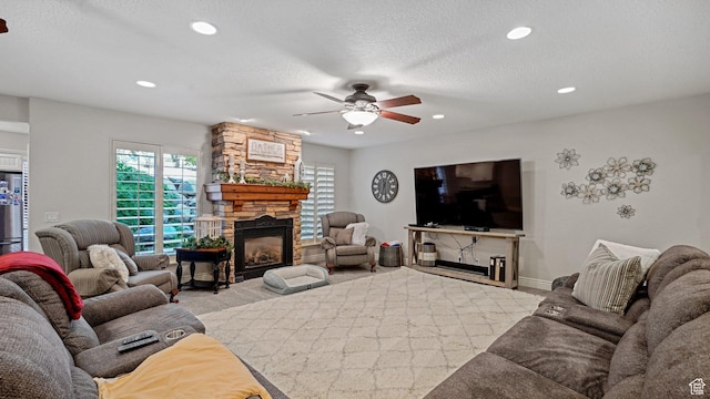 living area featuring recessed lighting, a textured ceiling, carpet flooring, ceiling fan, and a fireplace