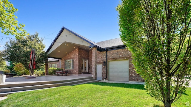 view of front of property with a front lawn, brick siding, roof with shingles, and a deck
