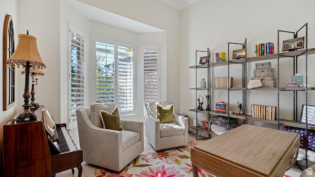 sitting room with a healthy amount of sunlight and wood finished floors