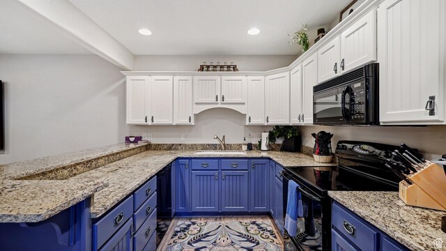 kitchen with black appliances, white cabinets, blue cabinets, and a sink