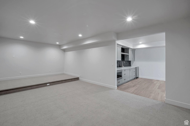 731 W Sara Dr, Saratoga Springs, UT 84045 - finished basement with light carpet, baseboards, recessed lighting, bar with sink, and wine cooler