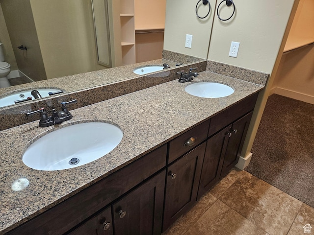 772 S 150 E, Smithfield, UT 84335 - bathroom featuring double vanity, a sink, and toilet