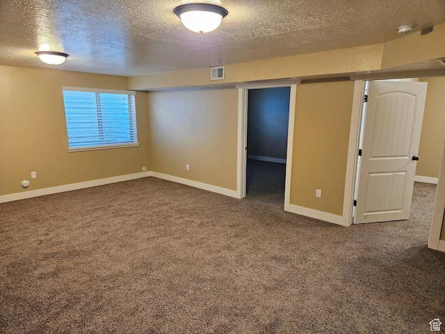 772 S 150 E, Smithfield, UT 84335 - spare room with visible vents, a textured ceiling, dark carpet, and baseboards