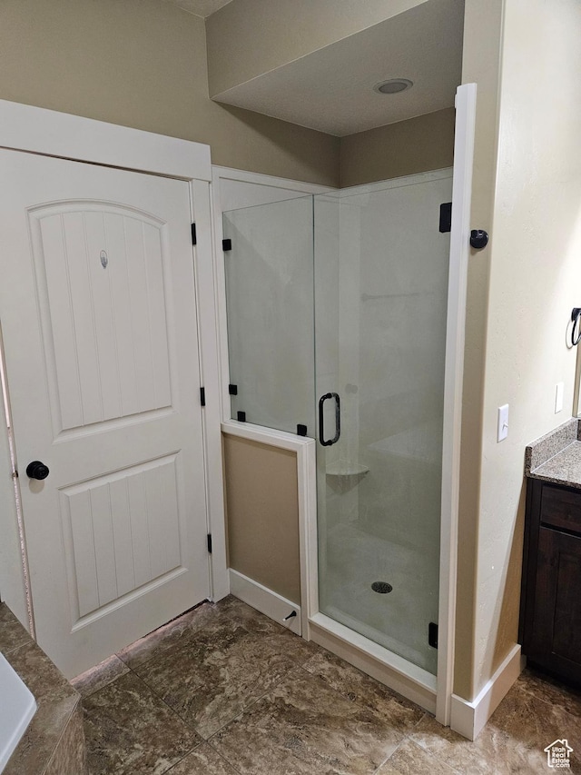 772 S 150 E, Smithfield, UT 84335 - bathroom with vanity, baseboards, and a shower stall