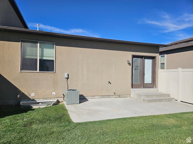 772 S 150 E, Smithfield, UT 84335 - back of property with a lawn, a patio area, and stucco siding