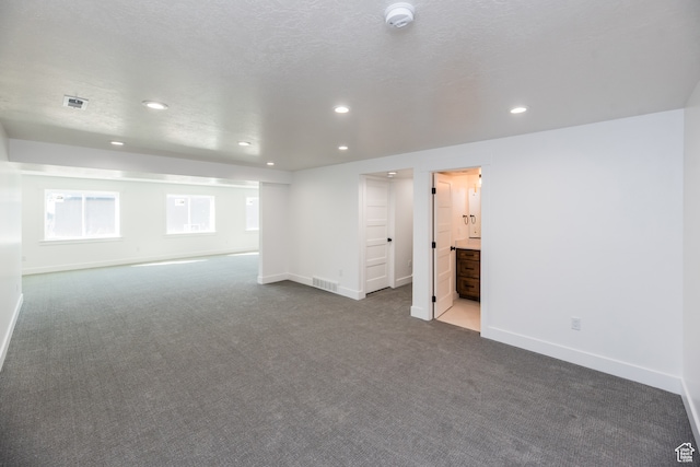 110 S 950 E Unit 45, Hyde Park, UT 84318 - carpeted spare room featuring a textured ceiling