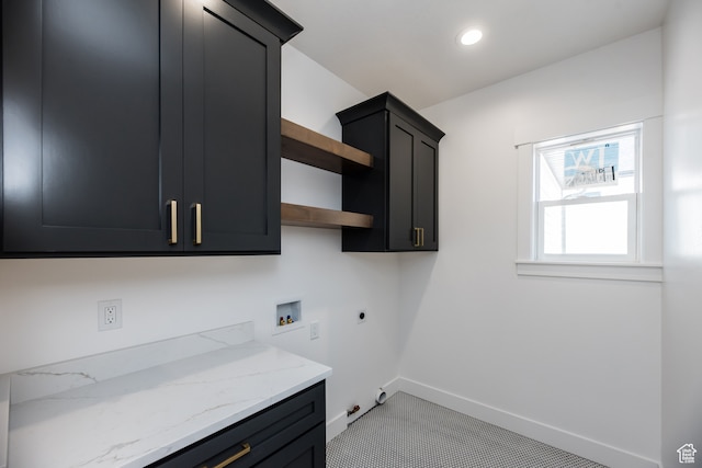 110 S 950 E Unit 45, Hyde Park, UT 84318 - laundry room featuring cabinets, hookup for an electric dryer, hookup for a gas dryer, light tile patterned floors, and hookup for a washing machine