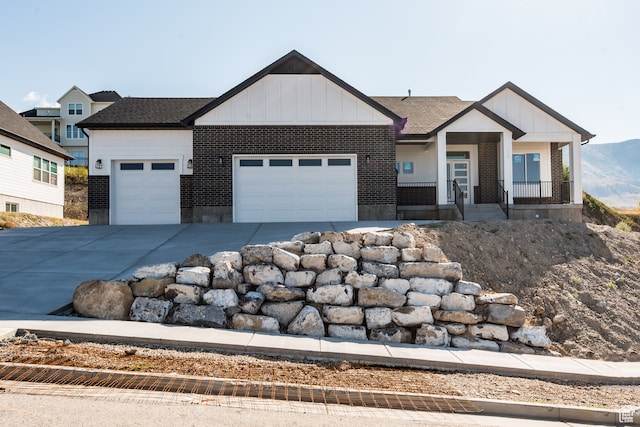 view of front of house with a porch and a garage