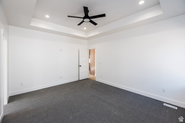 110 S 950 E Unit 45, Hyde Park, UT 84318 - spare room featuring dark colored carpet, a tray ceiling, and ceiling fan