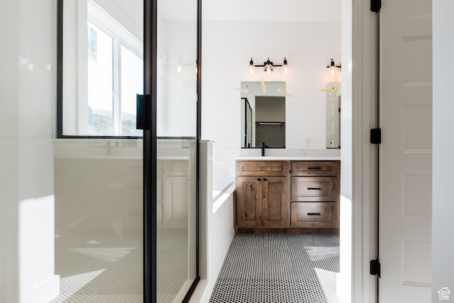 110 S 950 E Unit 45, Hyde Park, UT 84318 - bathroom with shower with separate bathtub, tile patterned floors, and vanity