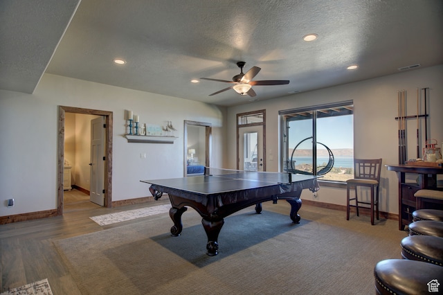 86 Aster Pl, Fish Haven, ID 83287 - playroom with light hardwood / wood-style floors, ceiling fan, and a textured ceiling