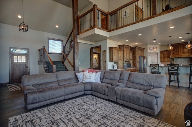86 Aster Pl, Fish Haven, ID 83287 - living room featuring a high ceiling and dark wood-type flooring
