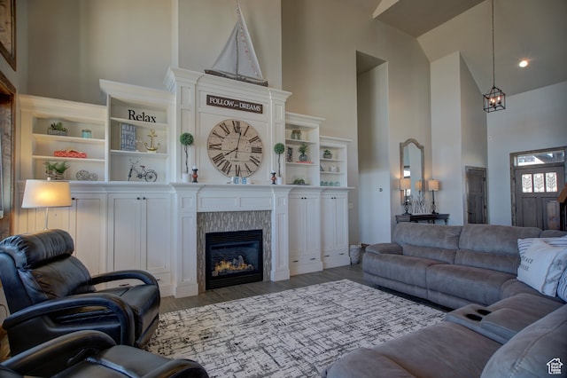 86 Aster Pl, Fish Haven, ID 83287 - living room featuring dark hardwood / wood-style flooring, high vaulted ceiling, and a tile fireplace