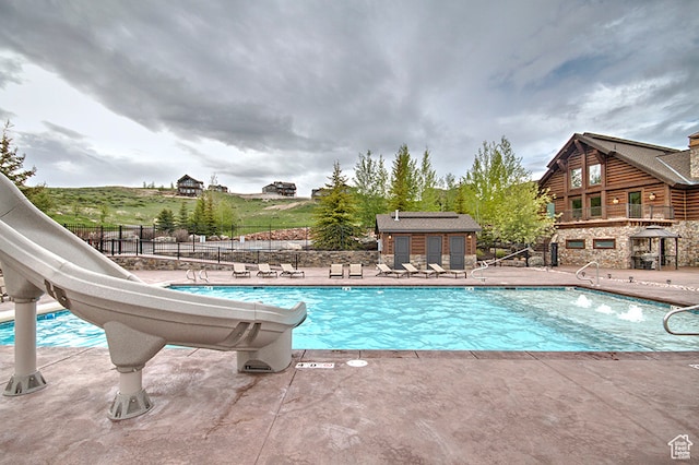 86 Aster Pl, Fish Haven, ID 83287 - view of swimming pool featuring a patio and a water slide