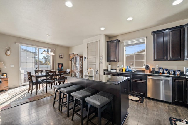 665 S 1400 W, Syracuse, UT 84075 - kitchen with dishwasher, a breakfast bar area, dark wood-style floors, and a notable chandelier