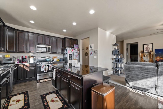 665 S 1400 W, Syracuse, UT 84075 - kitchen with recessed lighting, open floor plan, a kitchen island, dark wood finished floors, and appliances with stainless steel finishes