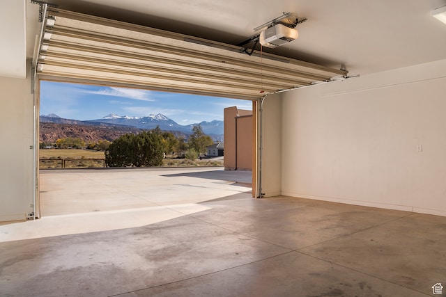 3862 Desert Willow Cir Unit A8, Moab, UT 84532 - garage featuring a garage door opener and a mountain view