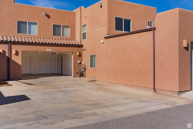 3862 Desert Willow Cir Unit A8, Moab, UT 84532 - rear view of house featuring a garage