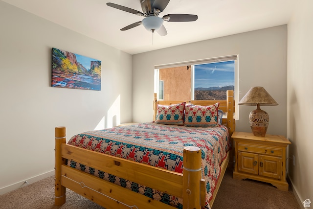 3862 Desert Willow Cir Unit A8, Moab, UT 84532 - bedroom with dark carpet and ceiling fan