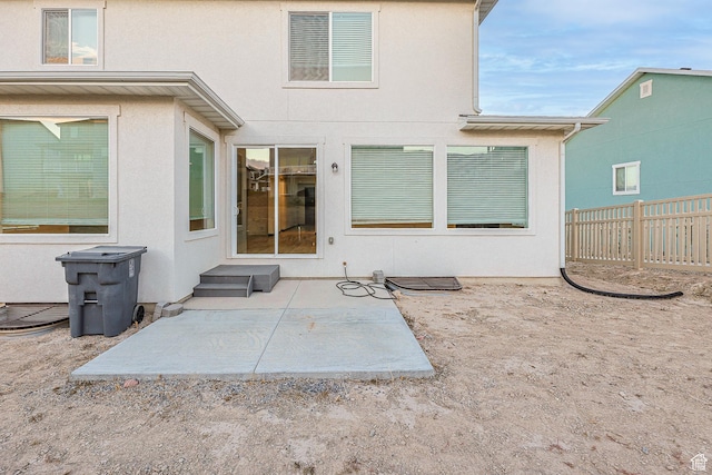 2867 S Greenhead Dr, Saratoga Springs, UT 84045 - back of property featuring a patio area, stucco siding, and fence