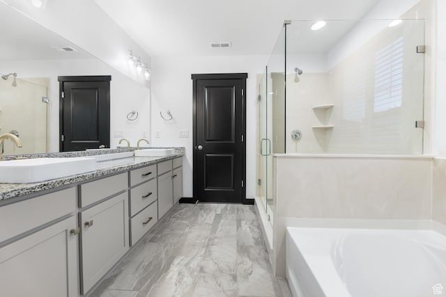 2867 S Greenhead Dr, Saratoga Springs, UT 84045 - bathroom featuring visible vents, a bath, double vanity, and a stall shower