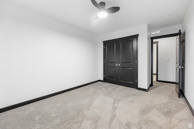 2867 S Greenhead Dr, Saratoga Springs, UT 84045 - unfurnished bedroom with ceiling fan, a closet, light colored carpet, and baseboards