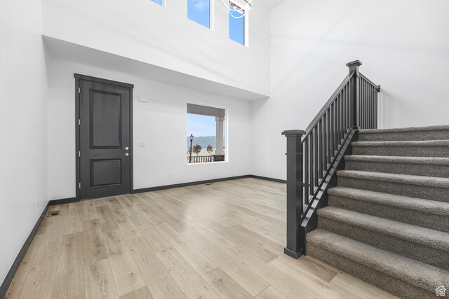 2867 S Greenhead Dr, Saratoga Springs, UT 84045 - foyer featuring stairway, baseboards, and wood finished floors