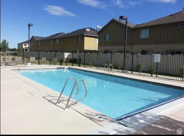 6912 S Village Haven Ln, Midvale, UT 84047 - view of pool with a patio