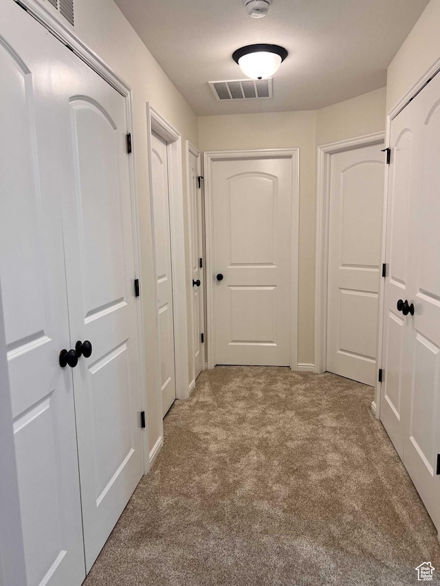 6912 S Village Haven Ln, Midvale, UT 84047 - hallway featuring light colored carpet