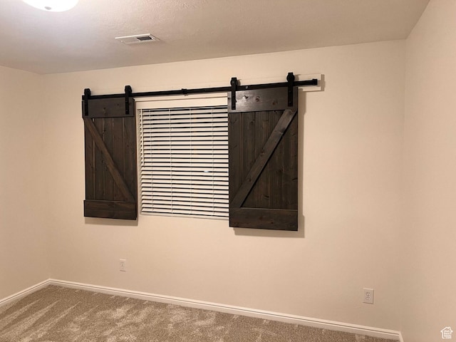 6912 S Village Haven Ln, Midvale, UT 84047 - details featuring a barn door and carpet flooring