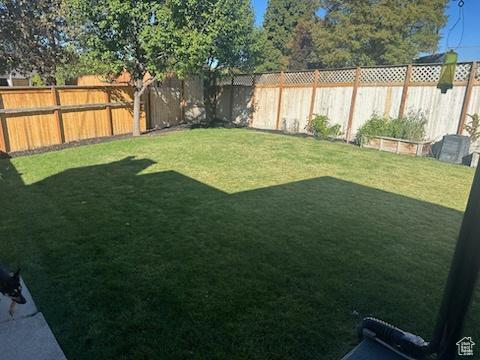 view of yard with a fenced backyard