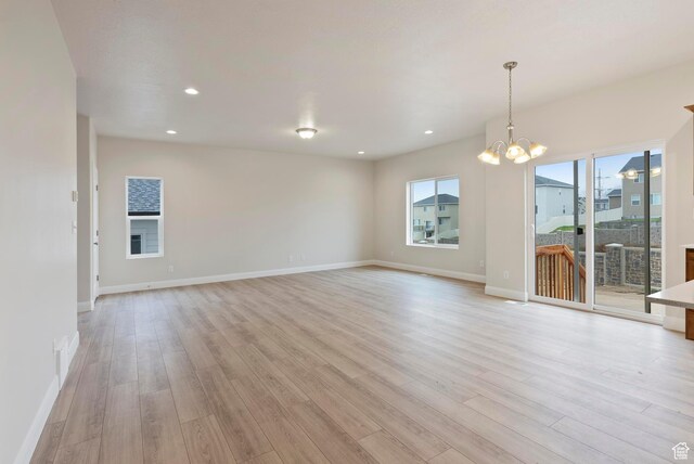 1696 S Windsong Dr Unit 362, Santaquin, UT 84655 - empty room featuring light hardwood / wood-style floors and a chandelier