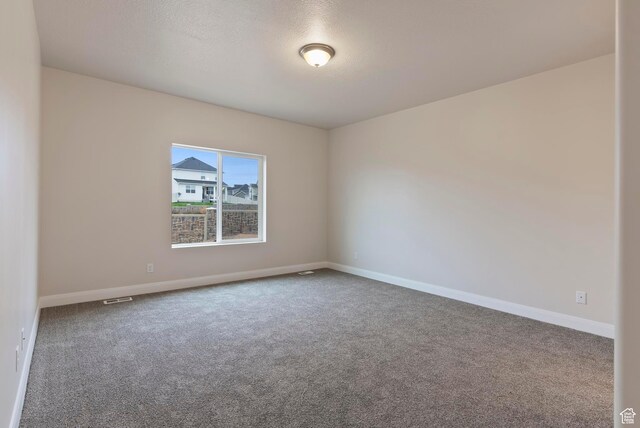 1696 S Windsong Dr Unit 362, Santaquin, UT 84655 - spare room with carpet floors and a textured ceiling