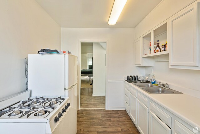 48 E 200 N, Salt Lake City, UT 84103 - kitchen with white cabinets, gas range gas stove, light countertops, a sink, and dark wood-style floors