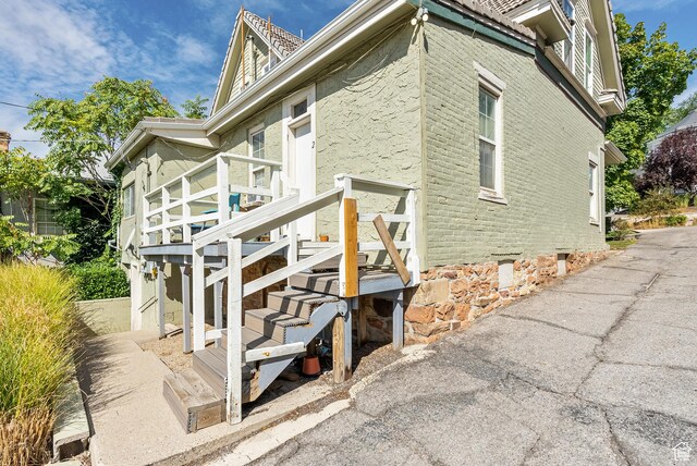 48 E 200 N, Salt Lake City, UT 84103 - view of side of home featuring stairway and brick siding
