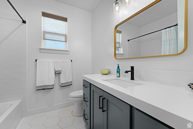 full bathroom with vanity, shower / bath combination with curtain, toilet, baseboards, and tile patterned flooring