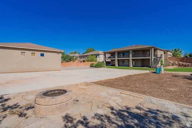 2042 Westcliff Dr, St George, UT 84790 - exterior space featuring a fire pit and stairs