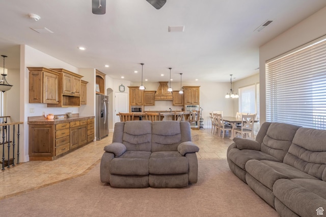 2042 Westcliff Dr, St George, UT 84790 - living area with baseboards, ceiling fan with notable chandelier, visible vents, and recessed lighting