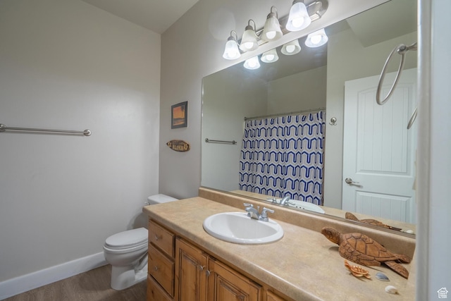 2042 Westcliff Dr, St George, UT 84790 - bathroom with curtained shower, wood finished floors, toilet, vanity, and baseboards
